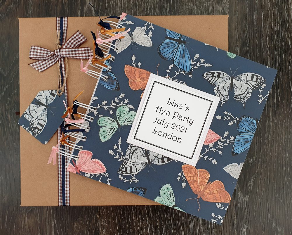hen party scrapbook with a butterfly background design and a kraft gift box
